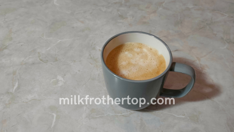 Frothed milk in a cup